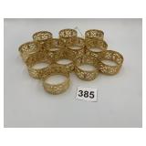 GOLD-TONE PIERCED FILIGREE NAPKIN RINGS.