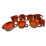 ORANGE GLAZED CERAMIC MUGS W/ CREAM RIM.
