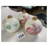 FLORAL DECORATED ORNAMENT CANDLES W/ GILT TOPS.