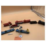 ASSORTED MODEL TRAIN ENGINES, CABOOSES, FLATBEDS,