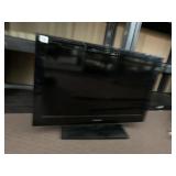 SANYO FLAT SCREEN TELEVISION W/ STAND.