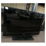 SANYO FLAT SCREEN TELEVISION W/ STAND.