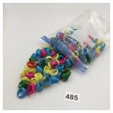 BAG OF ASSORTED PLASTIC DECORATIVE RINGS, VARIOUS