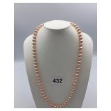 PINK FAUX PEARL NECKLACE, GOLD-TONE CLASP.