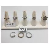 ASSORTED COSTUME RINGS, INCLUDES CLEAR STONE