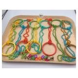 COSTUME JEWELRY NECKLACES W/ LARGE PLASTIC RINGS,