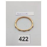 SWAROVSKI HINGED BANGLE BRACELET, GOLD-TONE