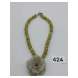 BEADED NECKLACE W/ CARVED STONE FLOWER PENDANT,