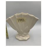 CREAM CERAMIC FAN-SHAPED FOOTED VASE.