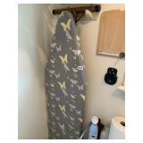 IRONING BOARD W/ BUTTERFLY PATTERN COVER.