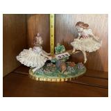 PORCELAIN FIGURINE, GIRLS ON SEESAW, FLORAL BASE,