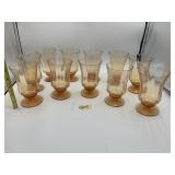 AMBER PRESSED GLASS FOOTED GOBLETS (10).