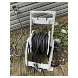 GARDEN HOSE W/ PLASTIC REEL CART.