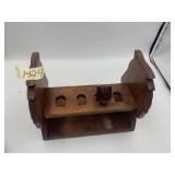 WOODEN CARVED PIPE RACK W/ SMOKING PIPE.