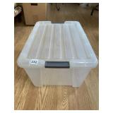 CLEAR PLASTIC STORAGE BIN W/ LID, GRAY HANDLES.