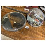 TWO MIRRORED VANITY TRAYS, ONE ROUND ORNATE, ONE