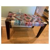 WOODEN STOOL W/ WOVEN RAG SEAT.