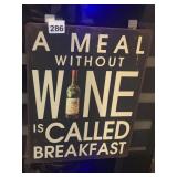 METAL WALL SIGN, 'A MEAL W/O WINE IS CALLED