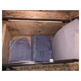 SOLID BLUE COTTON BEDDING SET, FOLDED.