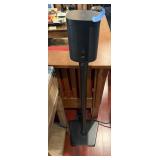SONOS SMART SPEAKER ON BLACK METAL FLOOR STAND.
