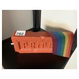 PLASTIC BRICK W/ PRIDE EMBOSSED LETTERING AND