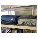 ASSORTED MOVING BLANKETS AND PROTECTIVE PADS.