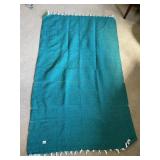 WOVEN TEXTILE THROW BLANKET, TEAL, FRINGED EDGES.
