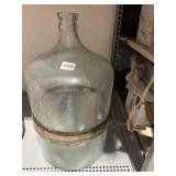 VTG CLEAR GLASS CARBOY W/ METAL BANDING.