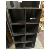 DARK WOOD LAMINATE EIGHT-CUBBY STORAGE UNIT.