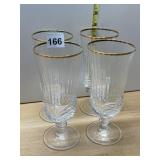 CRYSTAL CHAMPAGNE FLUTES W/ GOLD RIM (4).