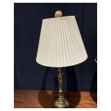 BRASS TABLE LAMP, PLEATED SHADE, SHELL FINIAL.