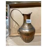 HAMMERED COPPER PITCHER, REPOUSSE FLORAL MOTIF,