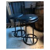 PAIR OF BLACK METAL BAR STOOLS, ROUND PADDED