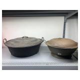 CAST IRON KETTLES, TWO LARGE ROUND COOKING POTS