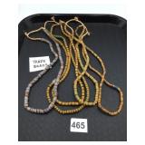 ASSORTED TRADE BEADS, STRUNG ON TWINE,