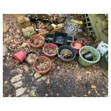 ASSORTED PLASTIC AND TERRA COTTA GARDEN PLANTERS,