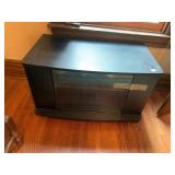 BLACK LAMINATE MEDIA CONSOLE, GLASS DOOR, CASTER