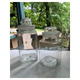 PAIR OF CLEAR GLASS CANISTERS, SQUARE BASE,