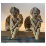 PAIR OF CERAMIC CHERUB FIGURINES, SEATED POSE,