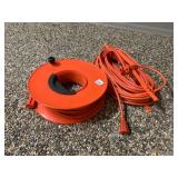 ORANGE EXTENSION CORD, PLASTIC REEL, W/ CORD