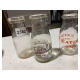 ASSORTED GLASS MILK BOTTLES, INCLUDES TRAILS END