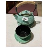 CAST IRON TEAPOT, TEACUP, AND SAUCER SET,