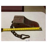 WOODEN WHEEL CHOCK, RED PAINT, ATTACHED IRON