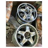 CHROME FIVE-SPOKE AUTOMOTIVE WHEEL RIMS.
