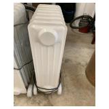 OIL-FILLED RADIATOR HEATER, WHITE, PORTABLE, ON