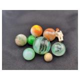 (8) ASSORTED GLASS MARBLES AND A FIGURINE