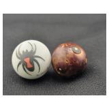 SPIDER AND BROWN MARBLES