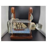 MODEL SHIP IN DECANTER SUSPENDED BY ROPES