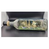 13" TRIANGULAR BOTTLE WITH MODEL SHIP INSIDE