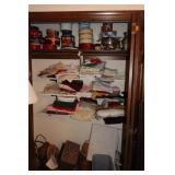 LINENS, BASKETS, TINS IN CLOSET